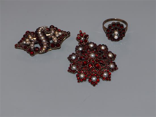 Two Victorian garnet set brooches and a similar ring.